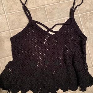 Free people black crochet tank top size
XS with floral detail